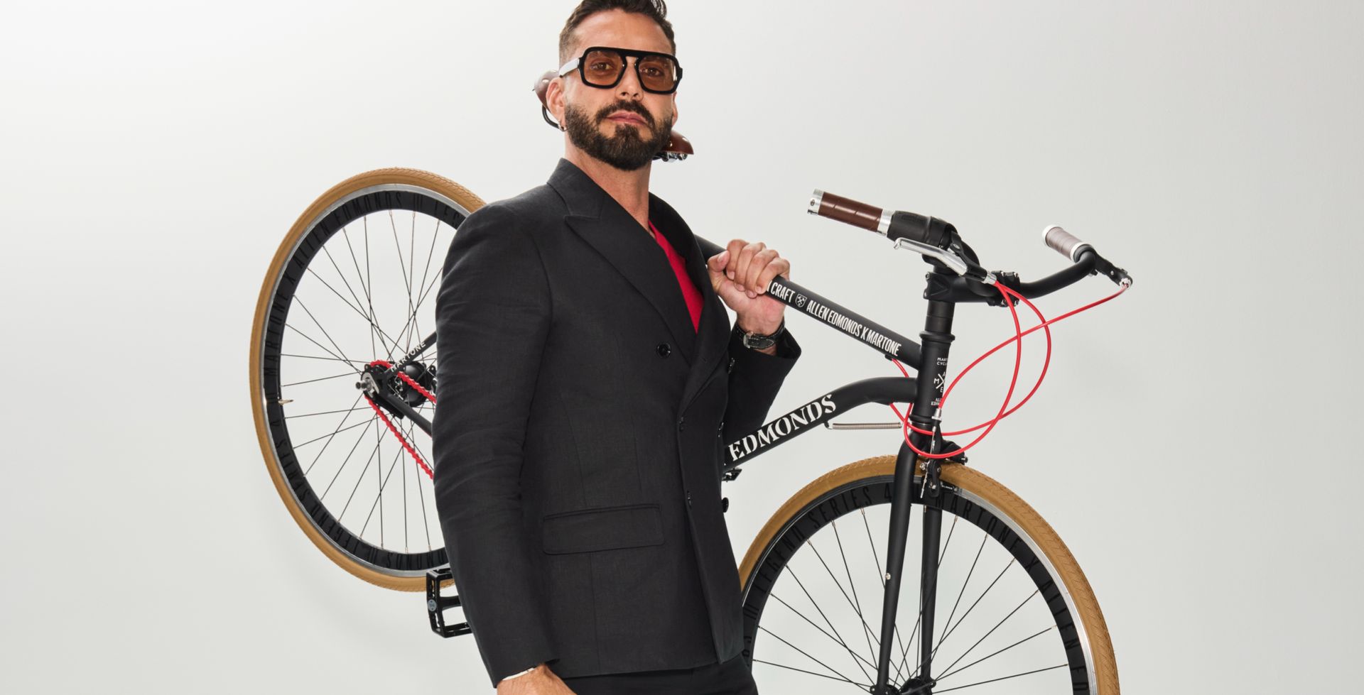 lorenzo martone holding a bicycle